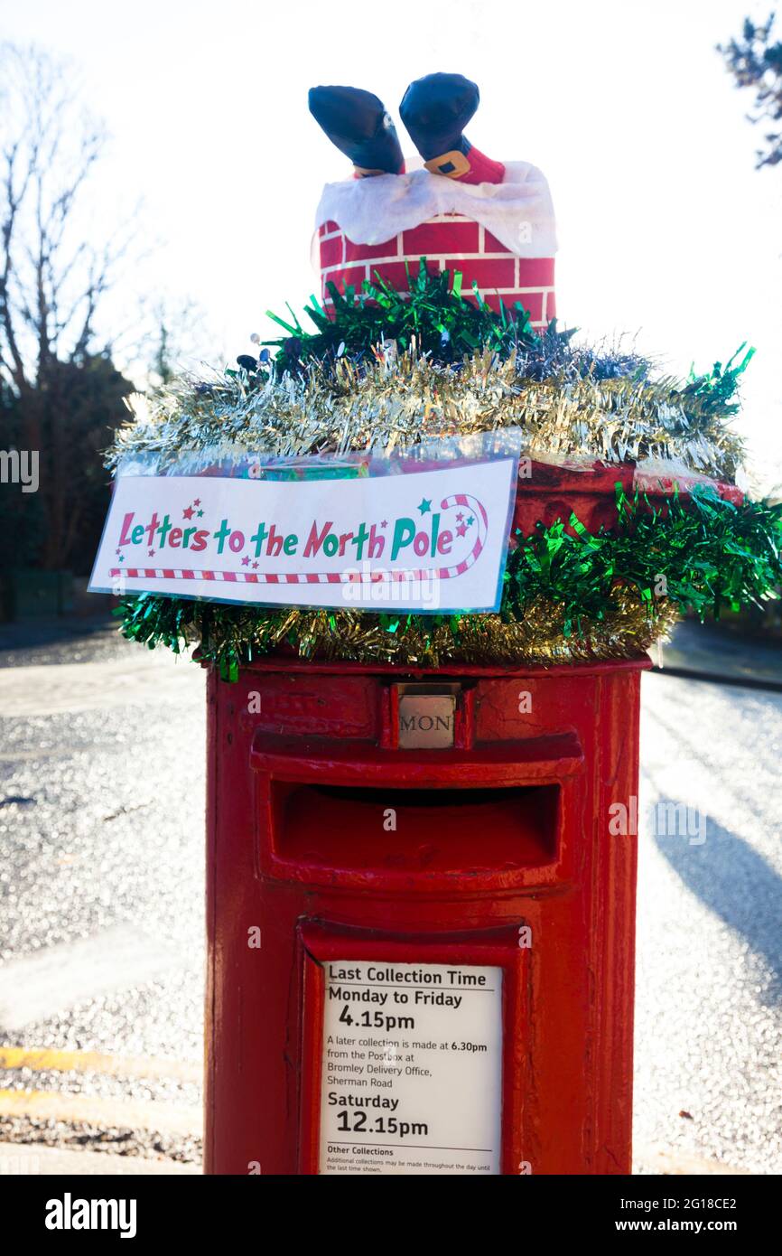 Post box dressed for Christmas, London, UK Stock Photo