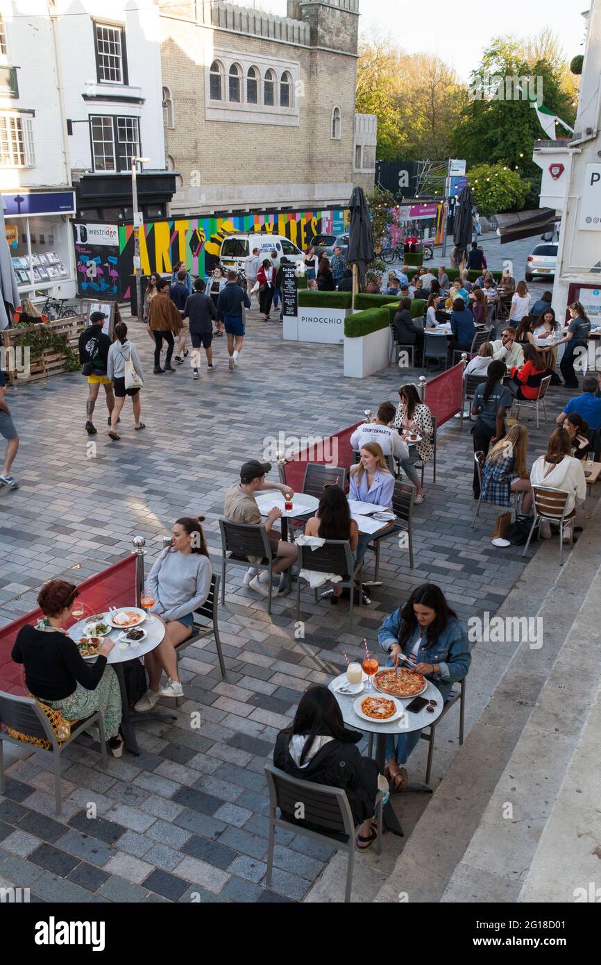 Diners eating al fresco at Pinnochio's restaurant in the North Laines of Brighton, UK Stock Photo