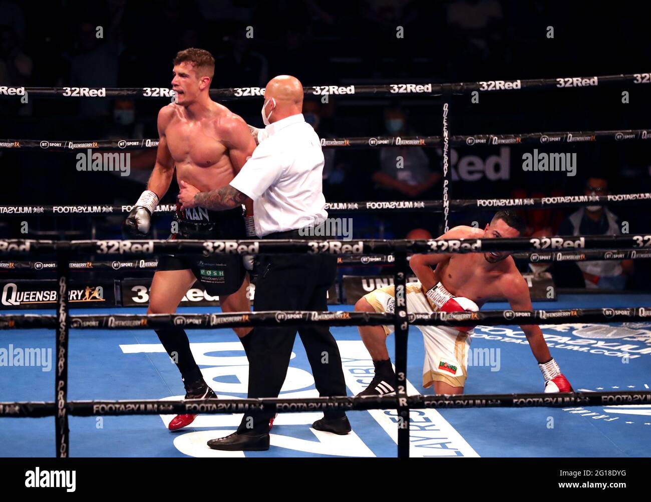 Nathan Heaney (left) knocks down Iliyan Markov in the International Middleweight Contest during the Boxing event at the Telford International Centre, Telford. Picture date: Saturday June 5, 2021. Stock Photo