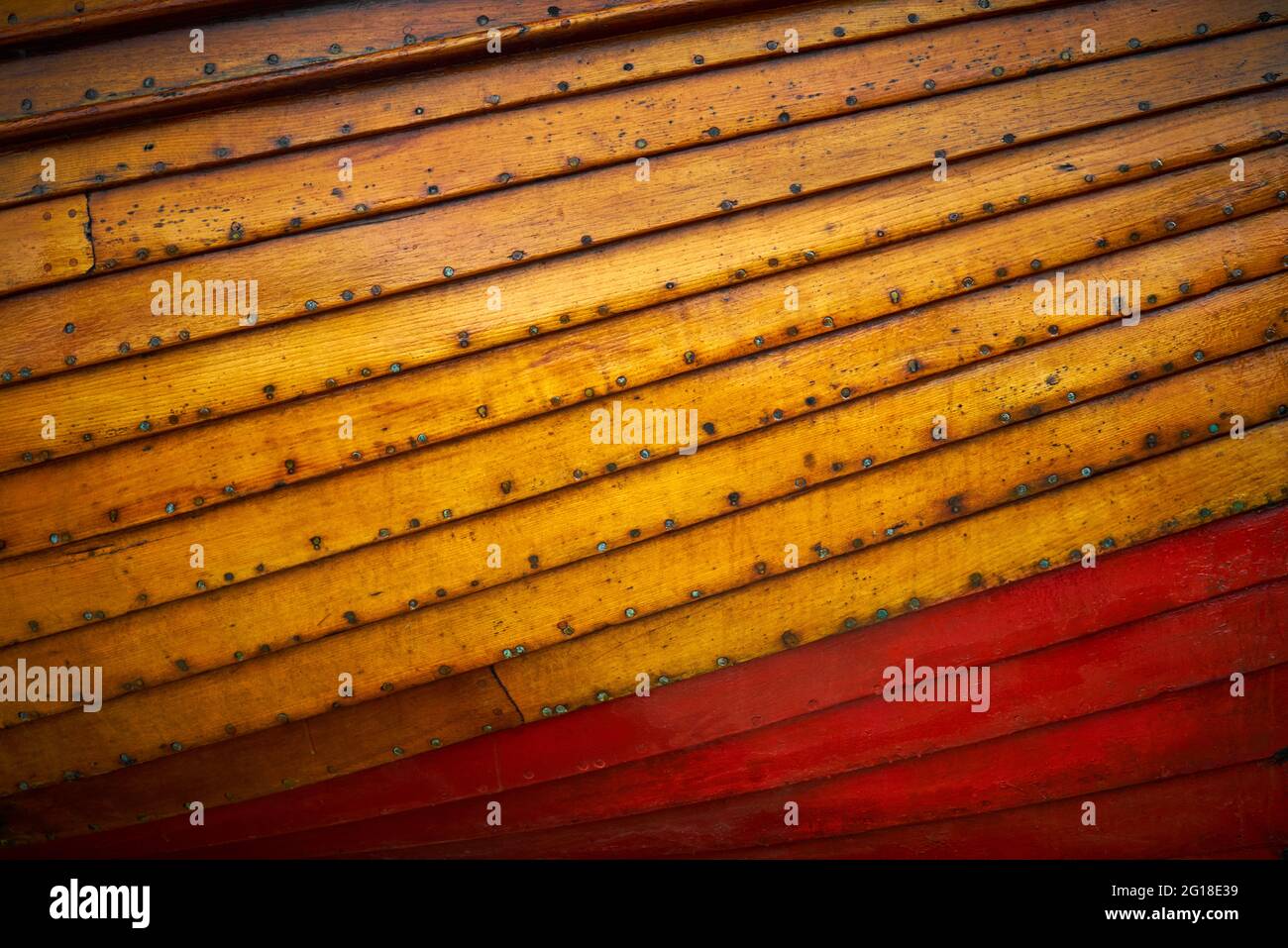 The wooden hull of a small boat for use as a background or texture Stock Photo