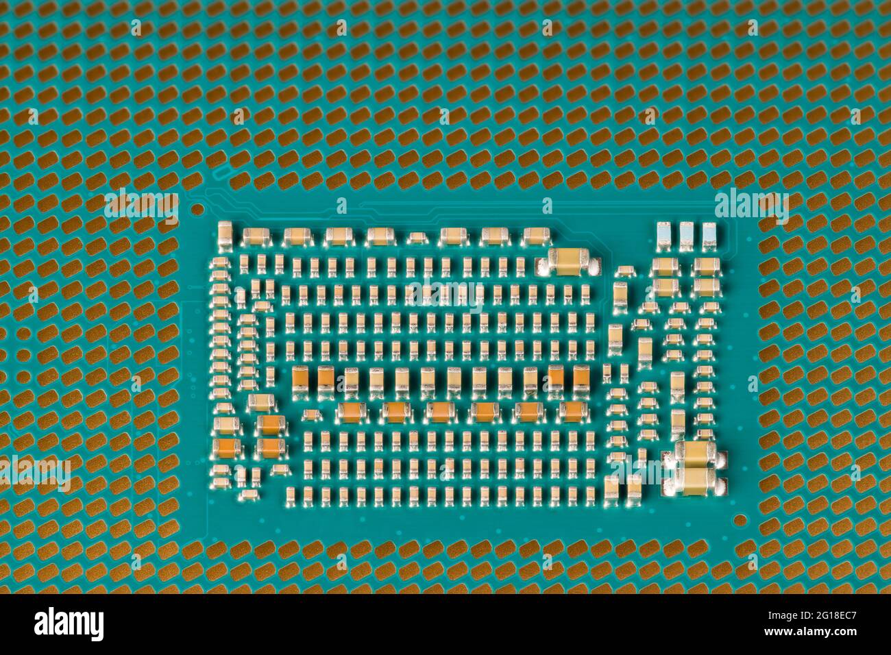 Detail of modern micro processor of computer motherboard. Land grid array packaging. Central processing unit from bottom. Electrical engineering. Tech. Stock Photo