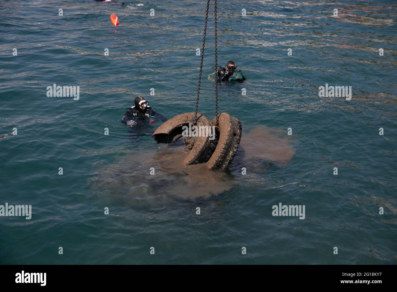 Rafina, Greece. 5th June, 2021. Rubber tires are pulled up at Rafina port, some 30 km east of Athens, Greece, on June 5, 2021. Greece is highlighting marine plastic pollution as it marks World Environment Day, which falls on June 5, and World Oceans Day on June 8, with the Shipping Ministry launching a project to clean up eight Greek ports. Credit: Lefteris Partsalis/Xinhua/Alamy Live News Stock Photo