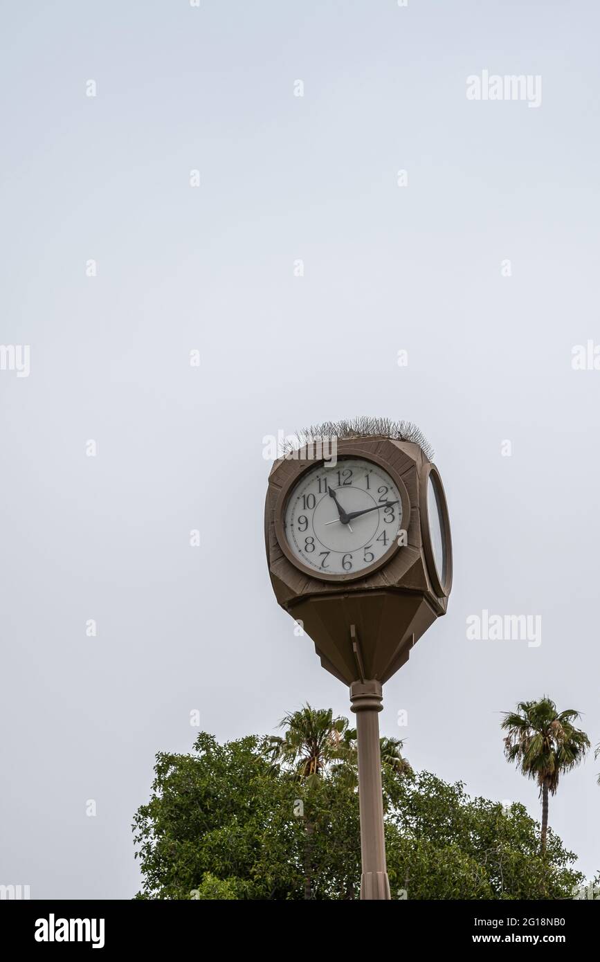 Clock on pole hi-res stock photography and images - Alamy