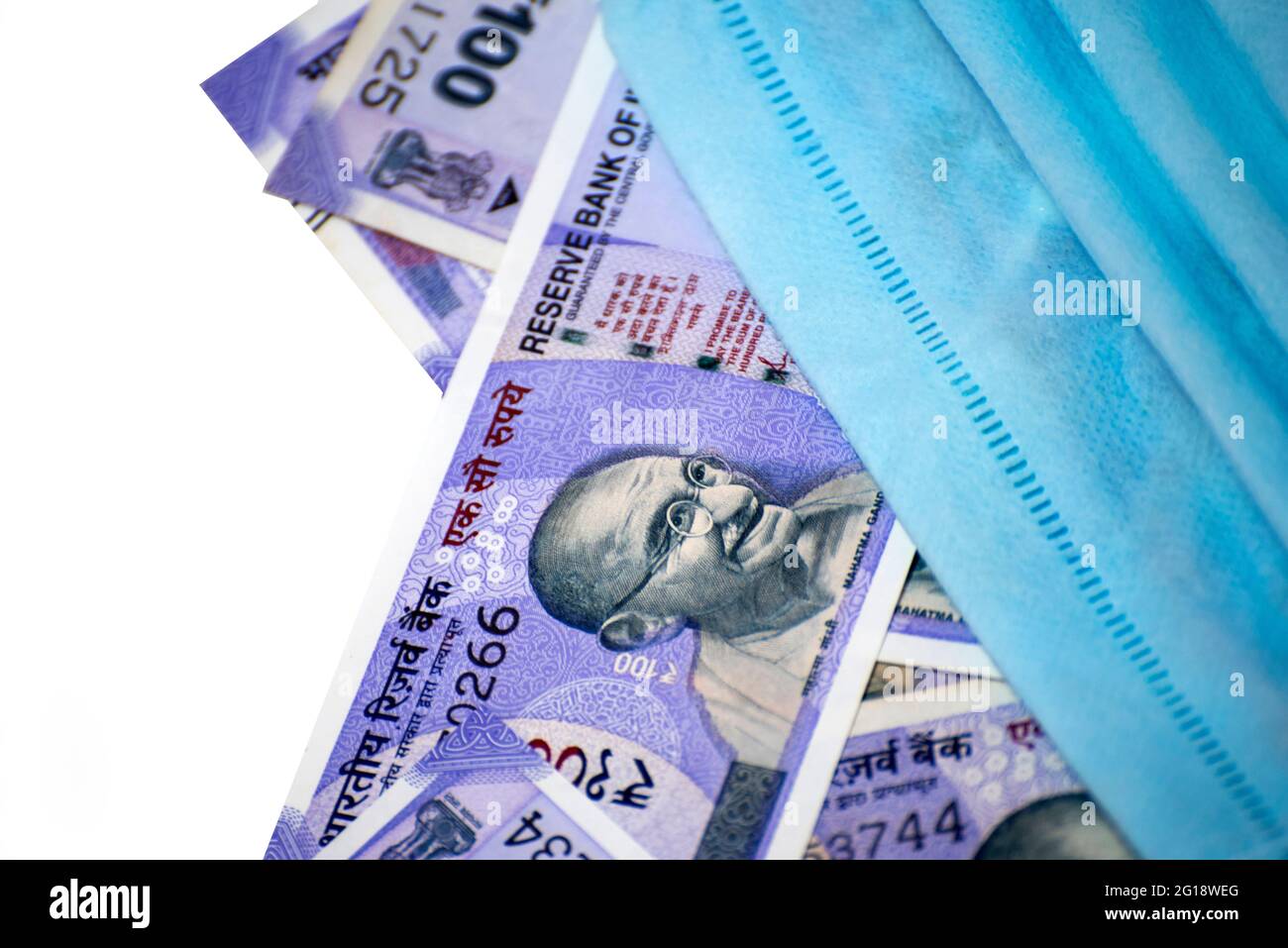 Indian rupee and protective face masks isolated on white background ...