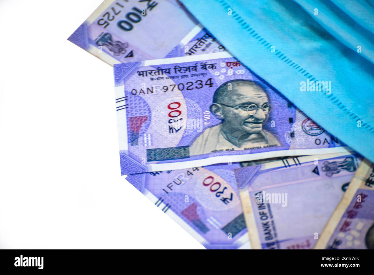 Indian rupee and protective face masks isolated on white background ...