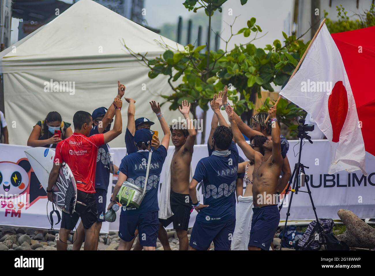 Members of the Japanese national surf team celebrate victory of their