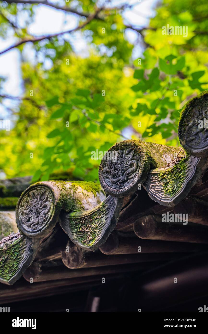 Close view of a grey tiles at a traditional Chinese architecture. Stock Photo