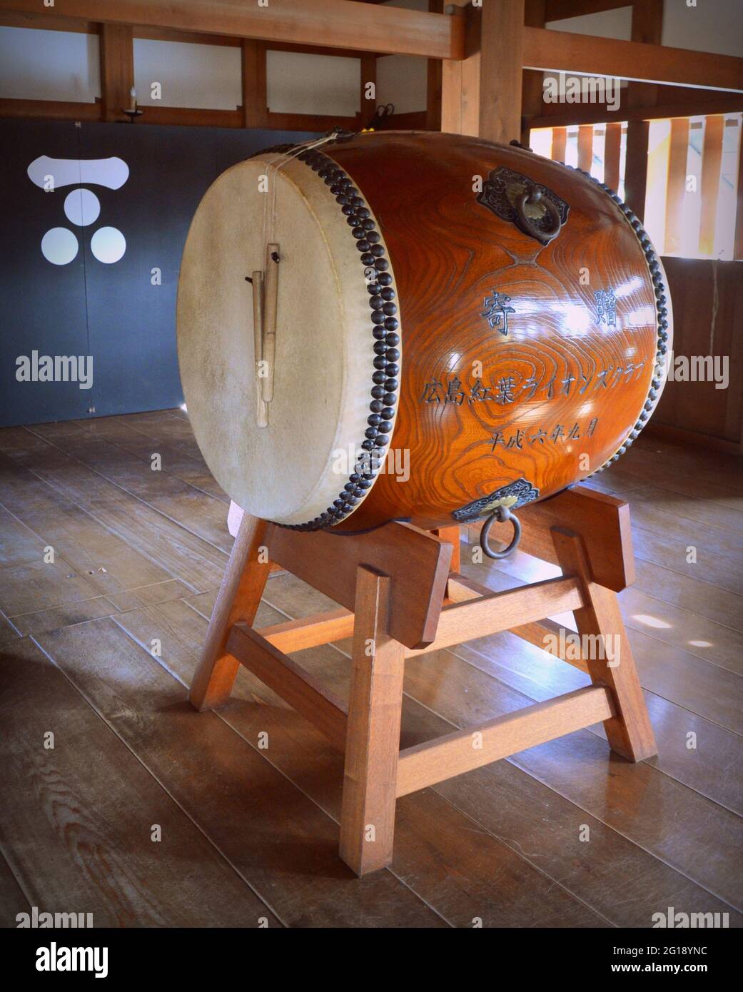 Taiko are a broad range of Japanese percussion instruments. These drums have a mythological origin in Japanese folklore. Hiroshima castle, Japan. Stock Photo