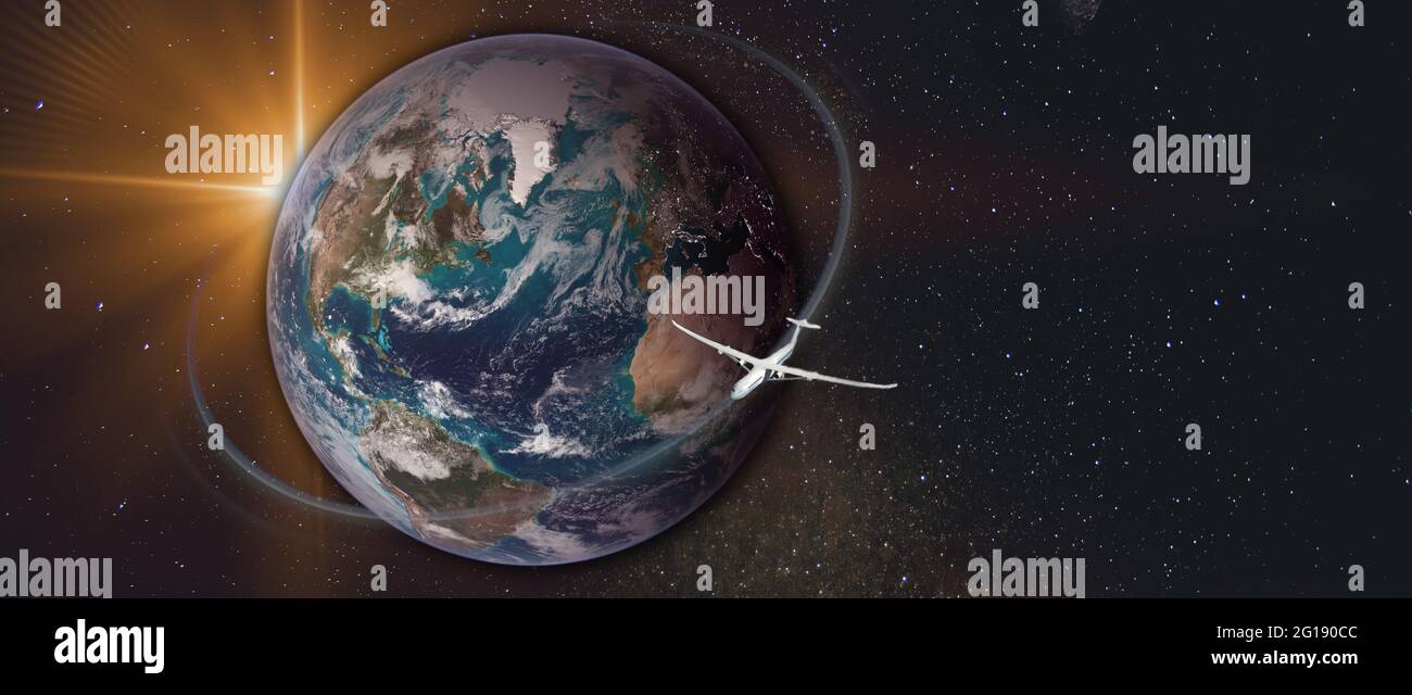 Transcontinental flight. Plane flies around the planet Earth. Starry space with copy space at the background. Flight path and sun flash. Elements of t Stock Photo