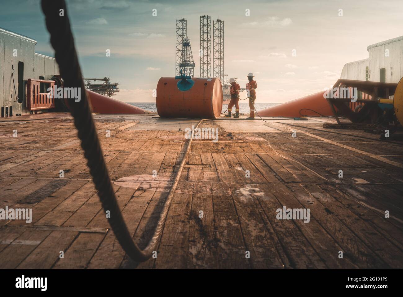 Offshore worker involvement in anchor handling operation Stock Photo