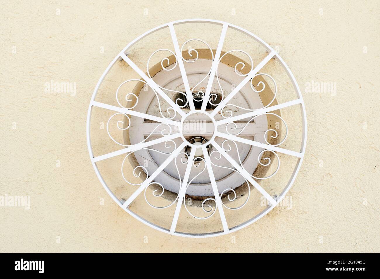 Vintage circular wooden window with ornamental white railing Stock ...
