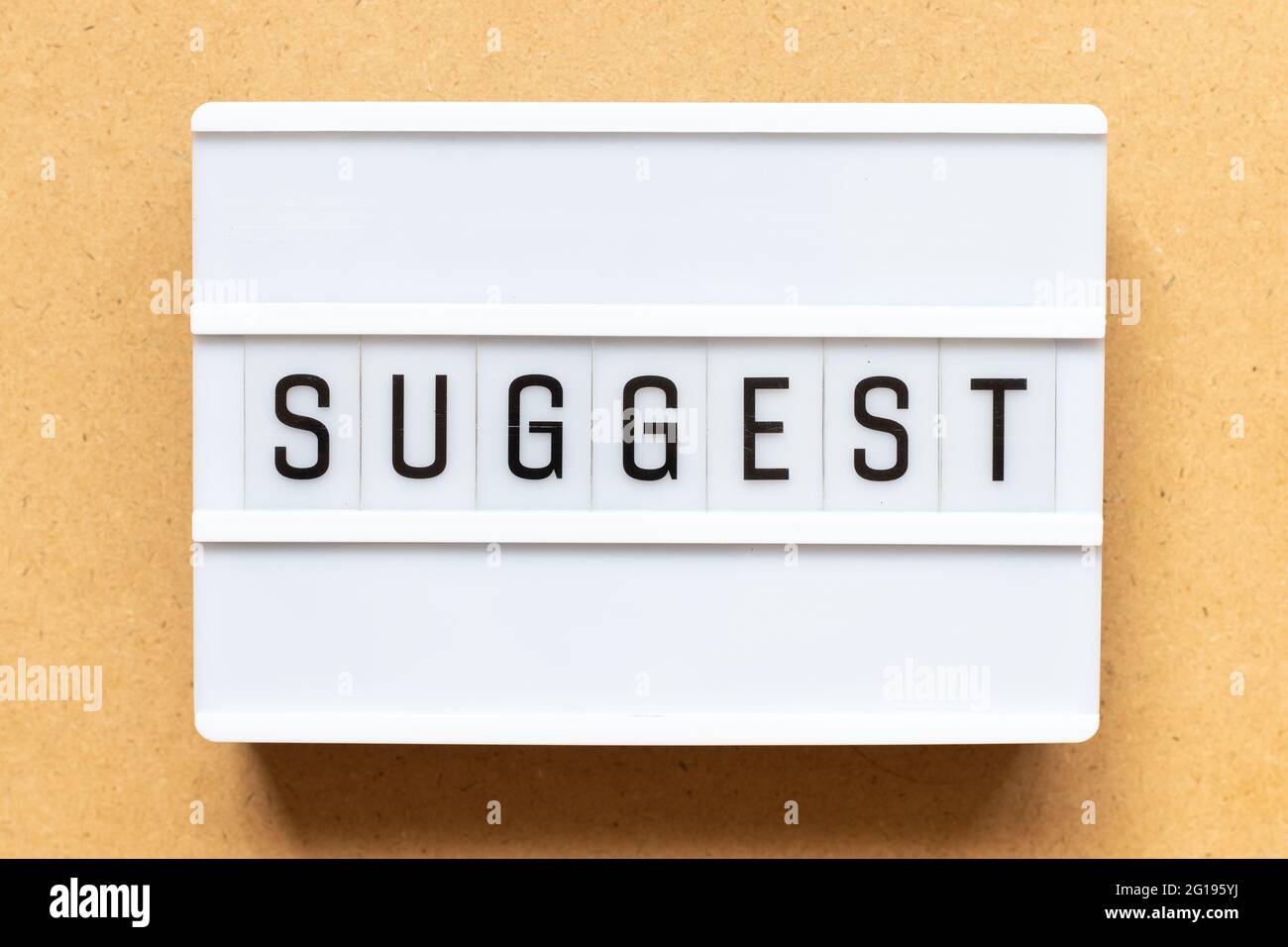 Lightbox with word suggest on wood background Stock Photo
