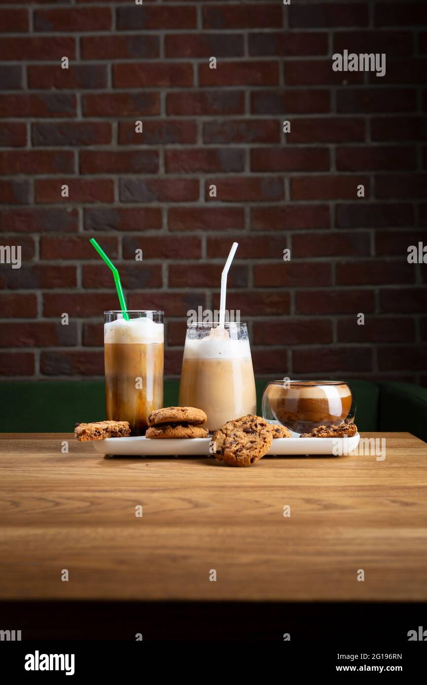 Cold coffee beverages set on wooden table Stock Photo