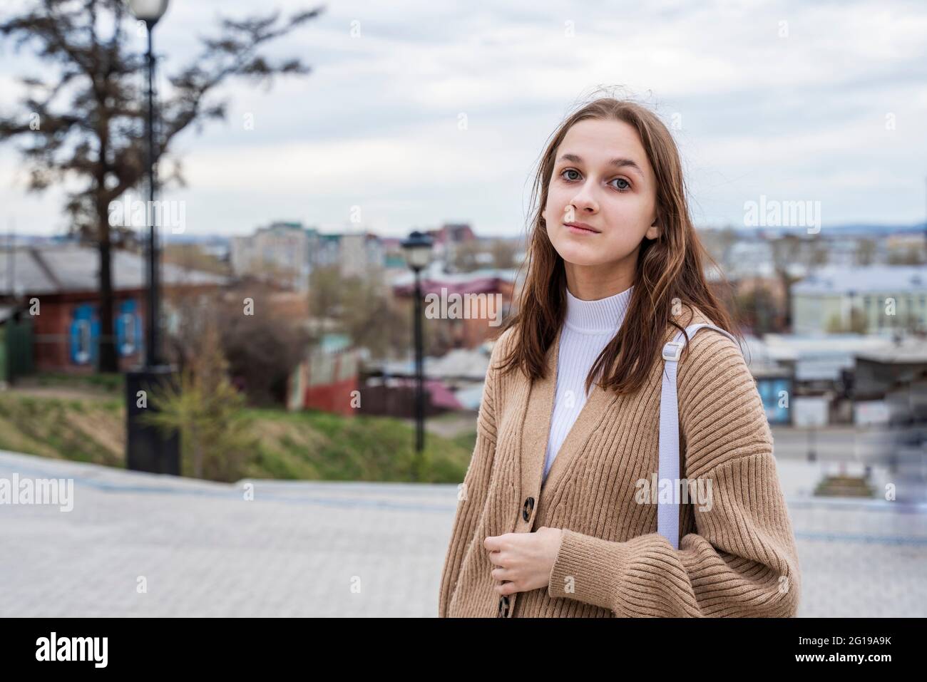 Portrait of a cute teenage girl on the street. Stock Photo