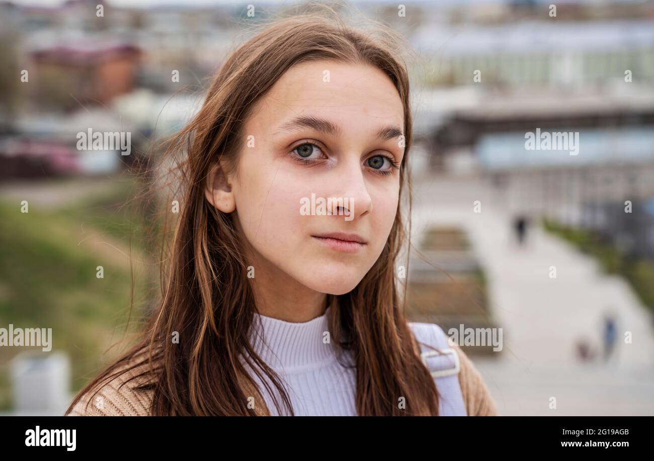 Portrait of a teenage girl on the background of the city. Stock Photo