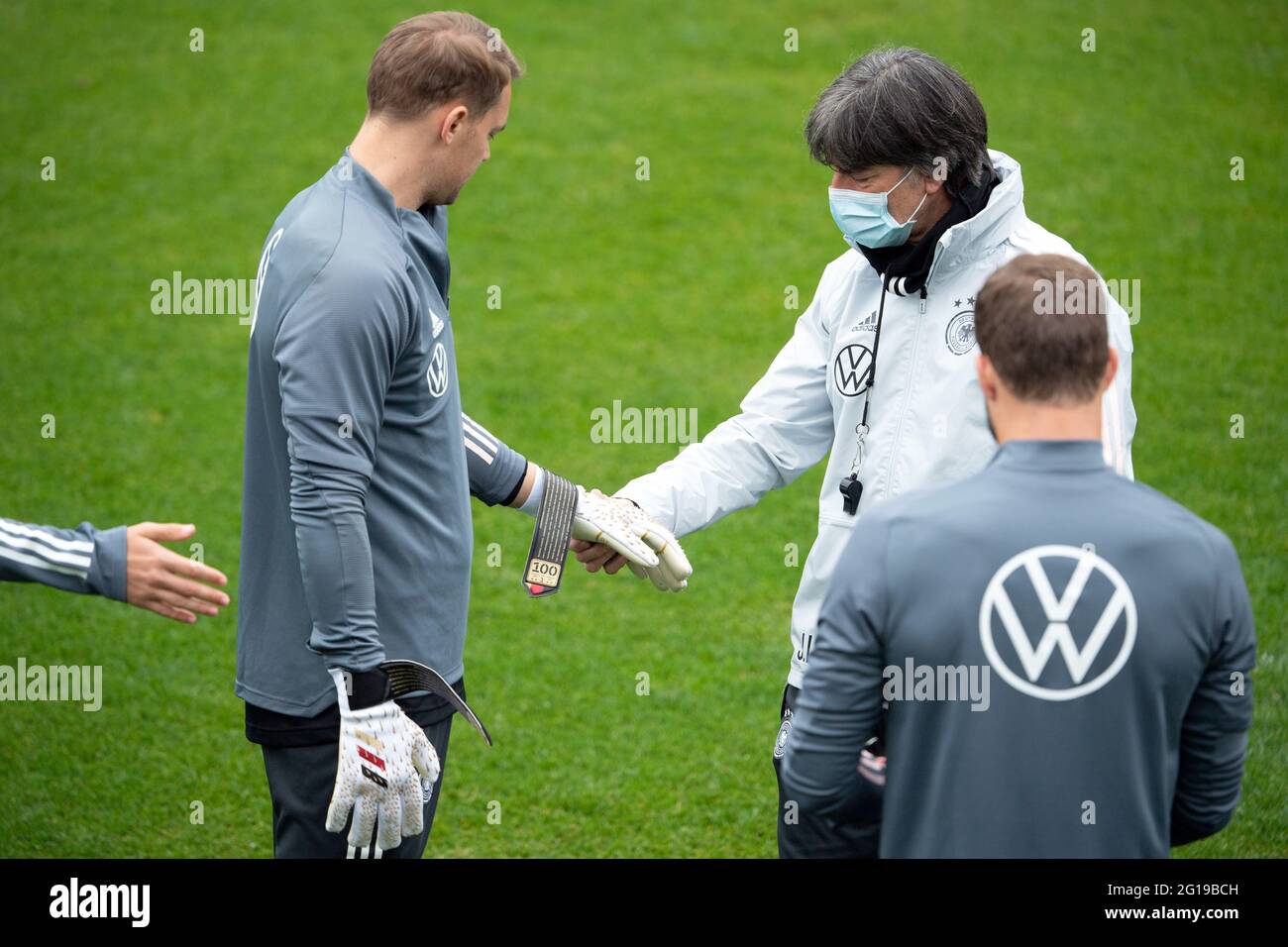 Seefeld, Austria. 06th June, 2021. Football: National team, training camp.  Germany's goalkeeper Manuel Neuer shows national coach Joachim Löw his  goalkeeper gloves, which he received for his 100th international match.  Credit: Federico