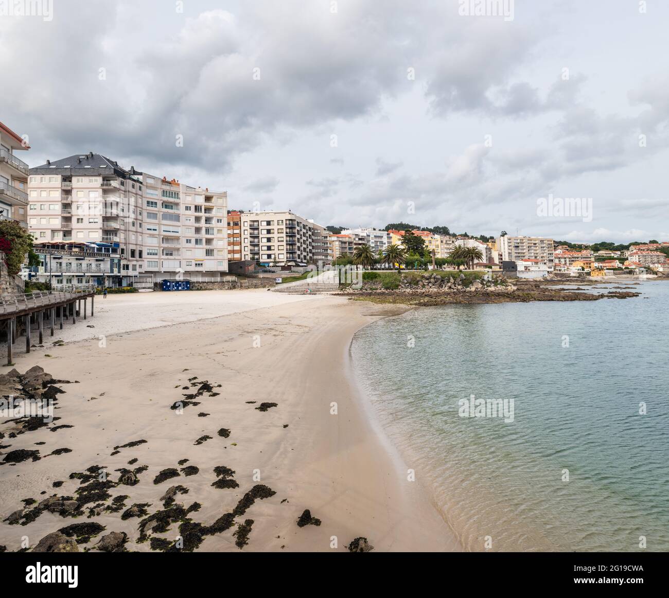SANXENXO, SPAIN - MAY 21, 2021: Wide-angle view of Sanxenxo and Panadeira beach on a cloudy Spring day in the Rias Baixas in Galicia, Spain. Stock Photo