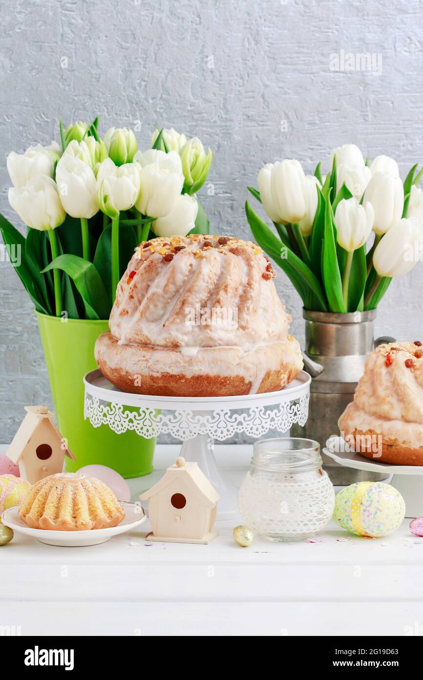 Easter table with cakes, eggs and flowers. Festive breakfast Stock Photo