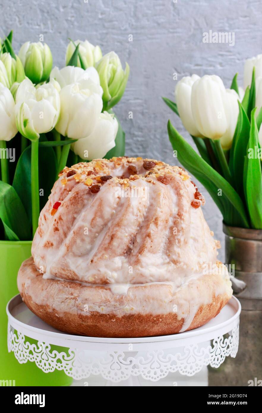Easter table with cakes, eggs and flowers. Festive breakfast Stock Photo