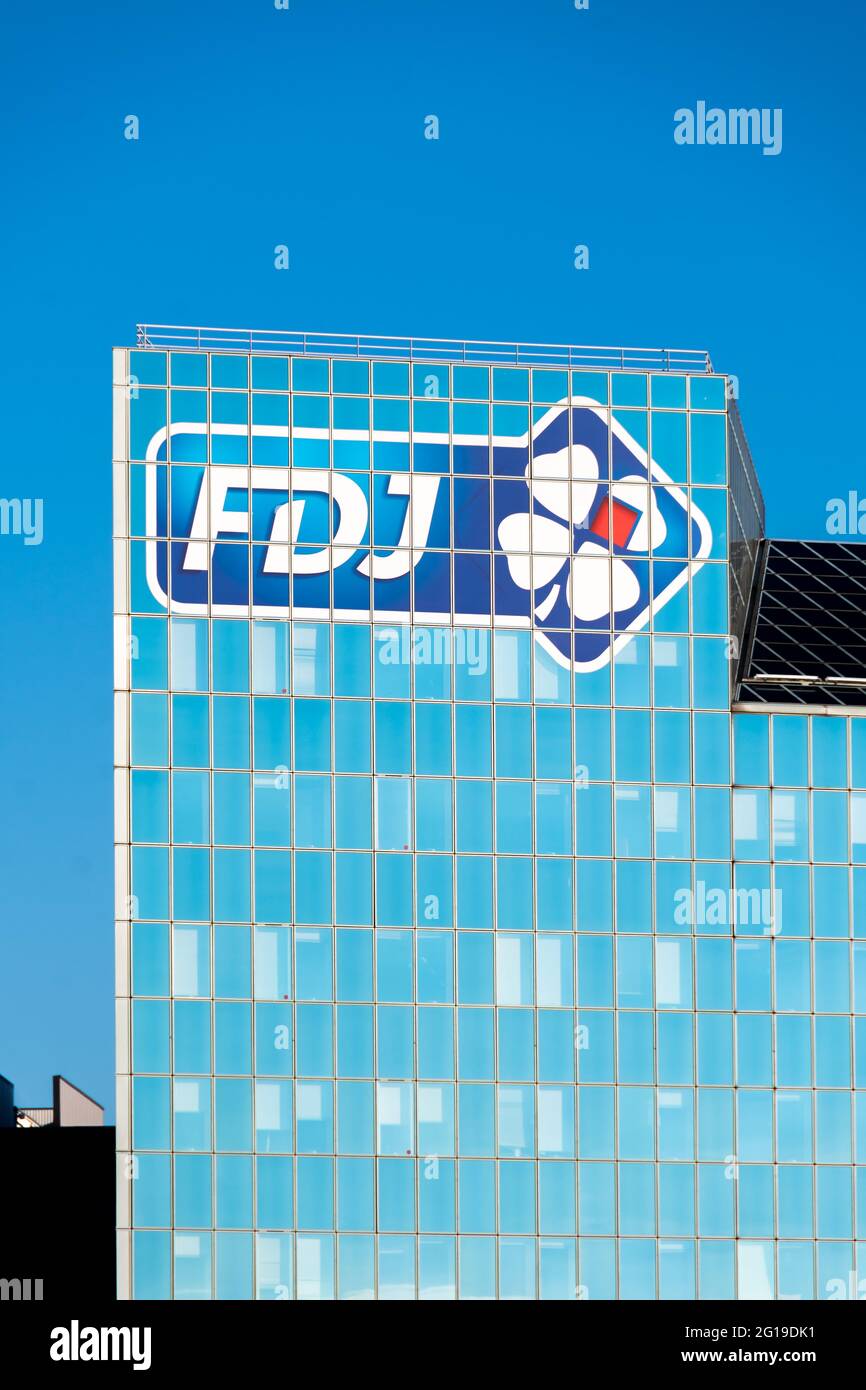 Logo on the headquarters building of Française Des Jeux (FDJ), French operator of national lottery games Stock Photo