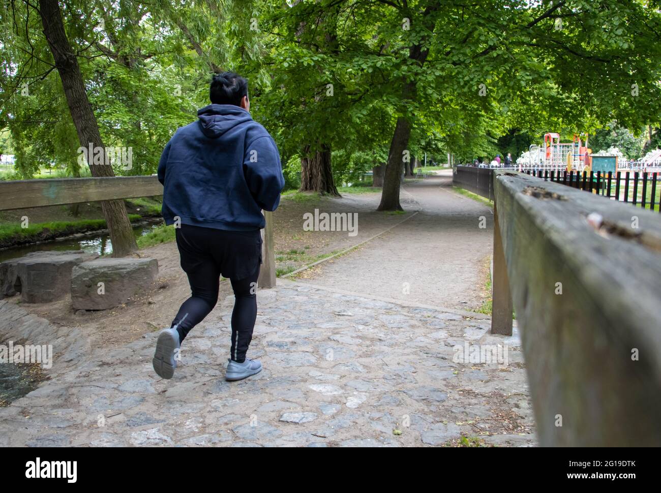PRAGUE, CZECHIA, MAY 26 2021, A woman running on a path in a city park. Stock Photo