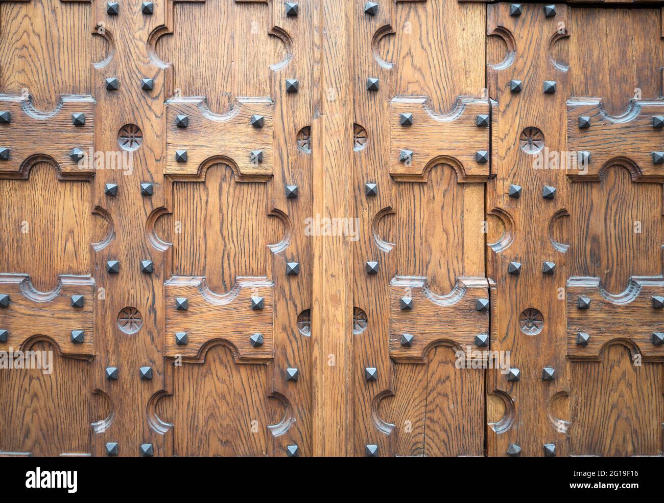 antique retro door with nails, vintage wood texture surface. wooden