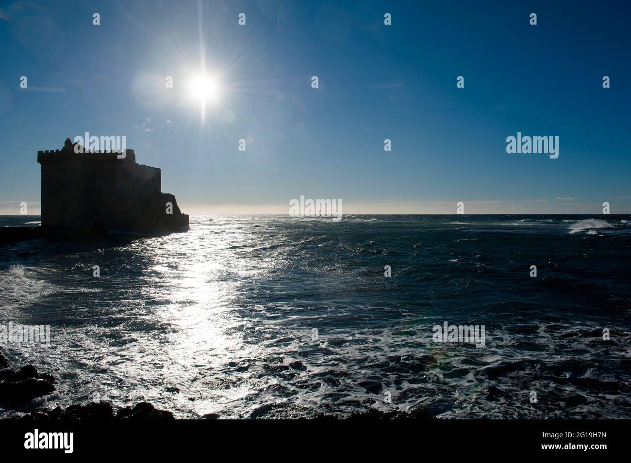 The  Fort de l'ile Saint-Honorat taken against the light; Île Saint-Honorat, near, Cannes, France Stock Photo
