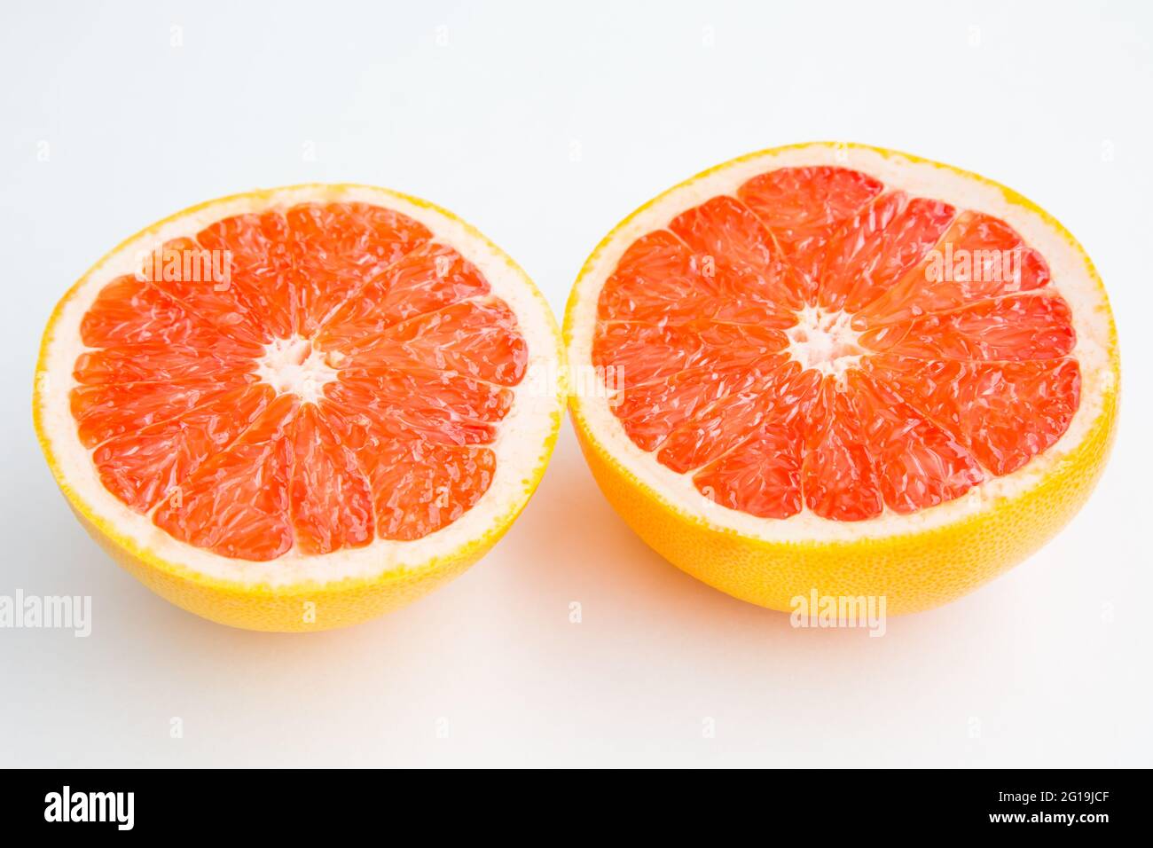 Fresh red cutted grapefruit isolated on white background Stock Photo