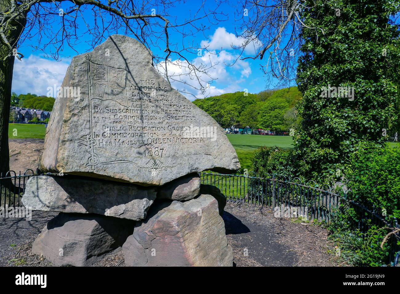 Gritstone boulder with text, Endcliffe Park in Summer in Sheffield, South Yorkshire, North of England, UK Stock Photo