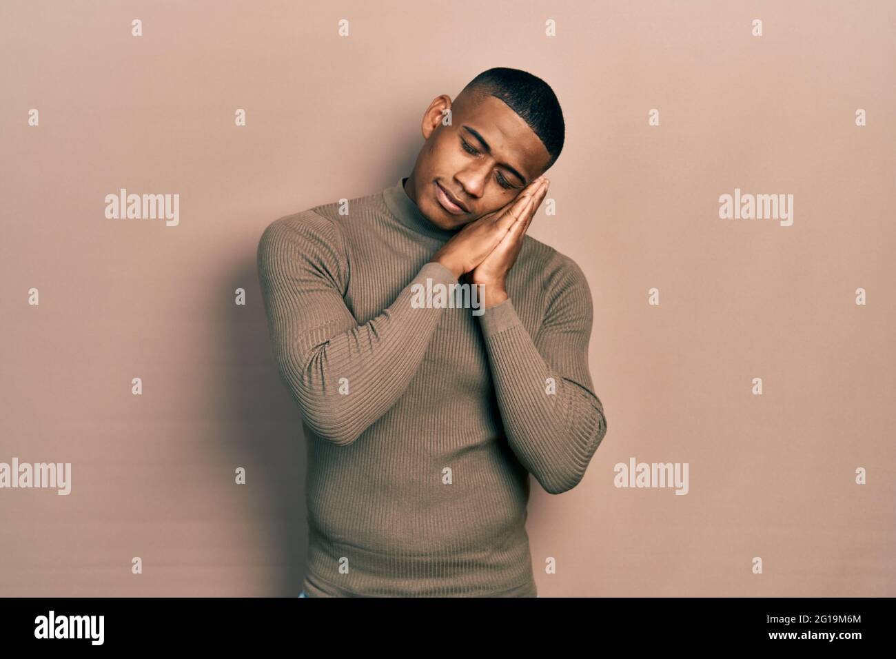 Young black man wearing casual turtleneck sweater sleeping tired ...