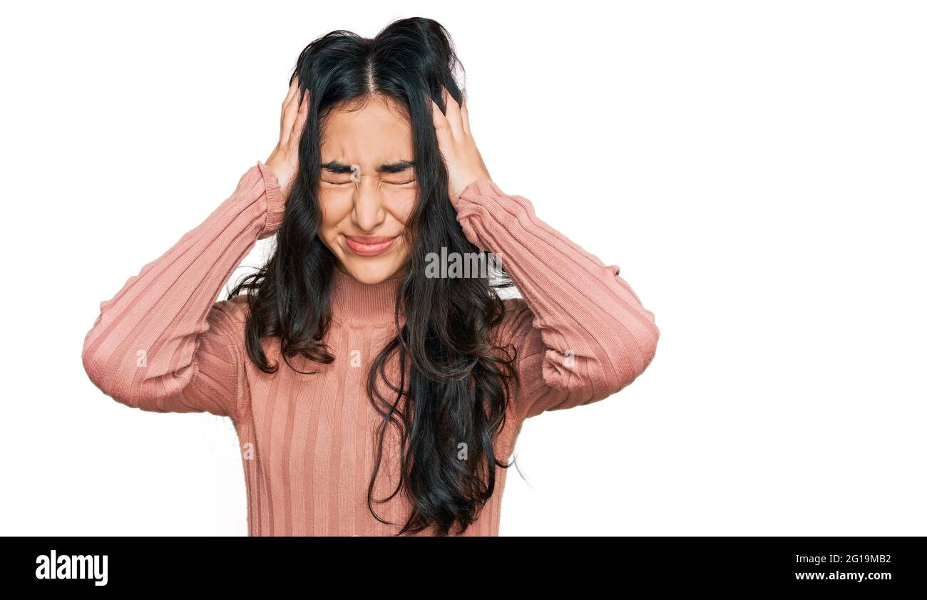 Hispanic teenager girl with dental braces wearing casual clothes