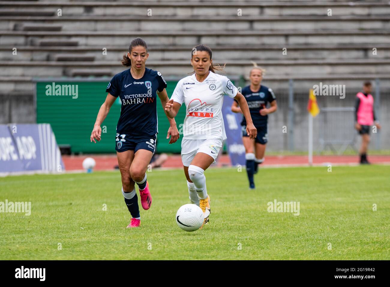 Clara Mateo of Paris FC and Ines Belloumou of Montpellier Herault Sport  Club fight for the ball during the Women's French championship D1 Arkema  football match between Paris FC and Montpellier HSC