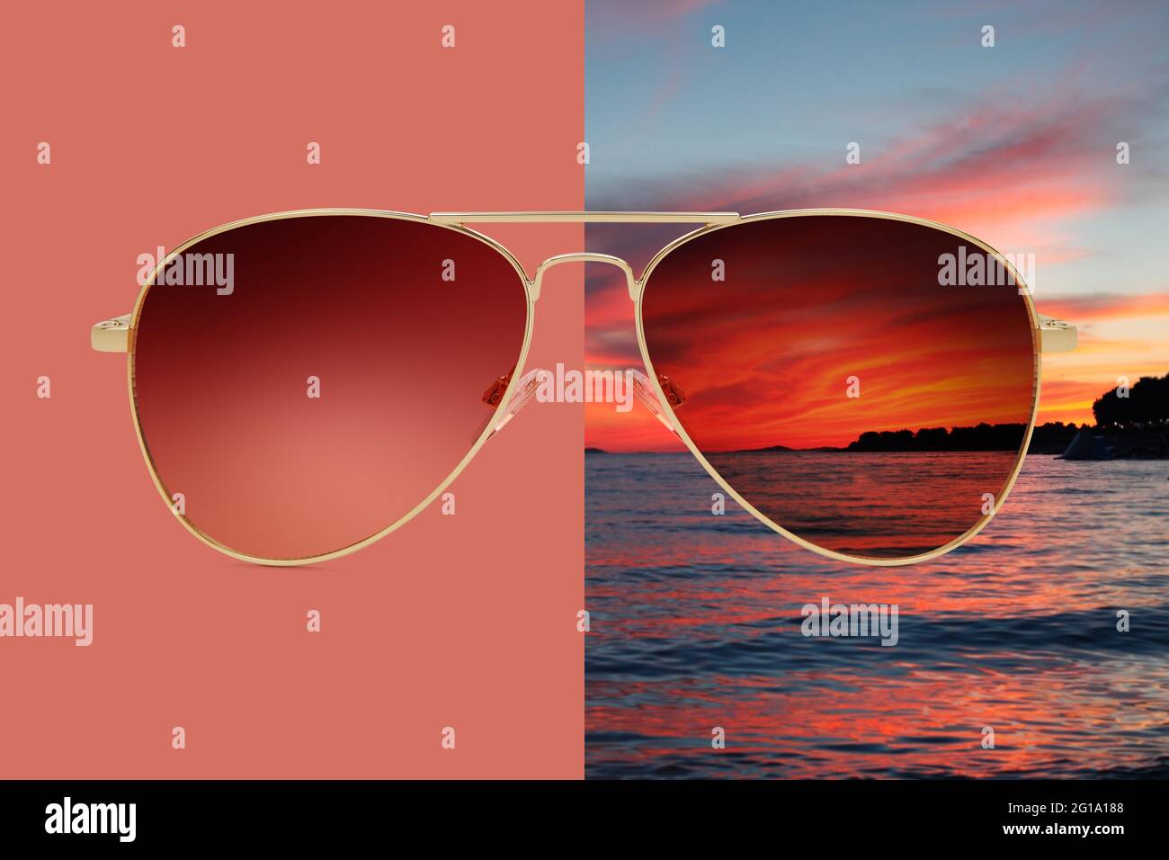 aviator sunglasses isolated on red and summer sunset background with sea and red sky, concept of polarized protective lenses Stock Photo
