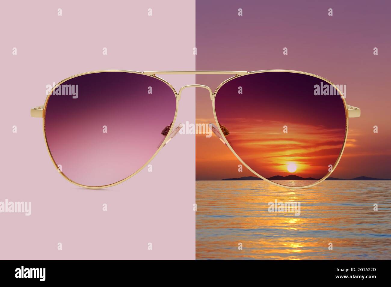 aviator sunglasses isolated on pink and summer sunset background with sea and red sky, concept of polarized protective lenses Stock Photo