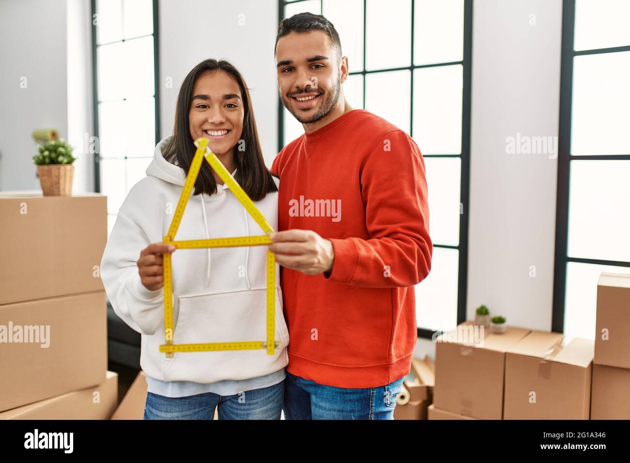 Young latin couple smiling happy holding house project new home Stock ...