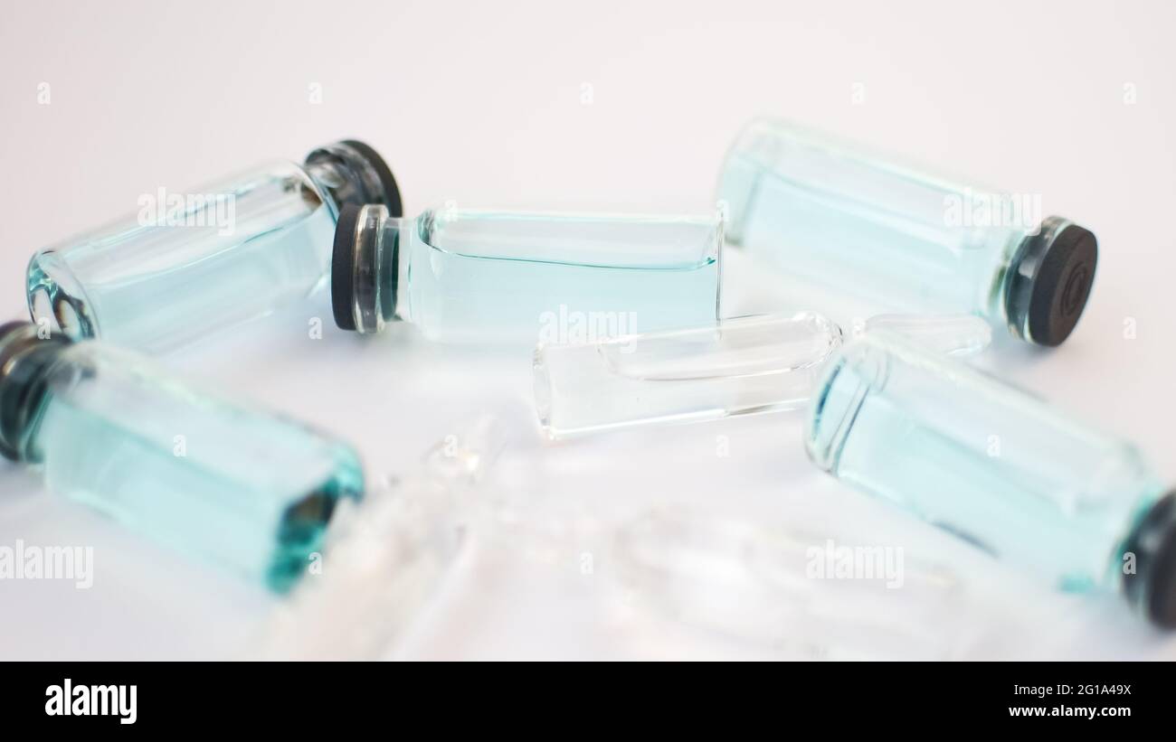 Vial vaccine, top view of glass ampoules with transparent and blue ...