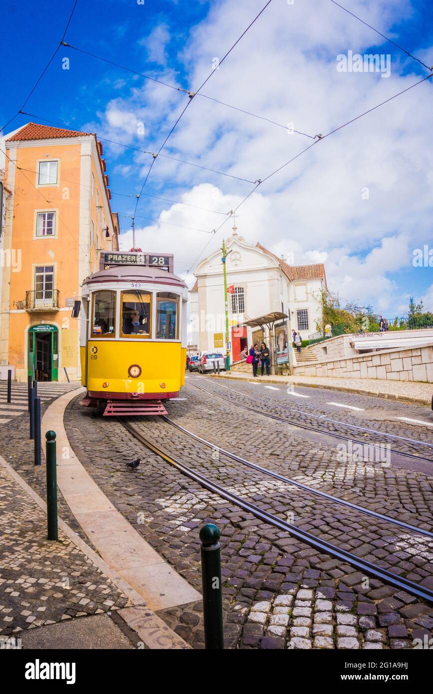 Vintage yellow old touristic 28 tram in Lisbon, Portugal Stock Photo