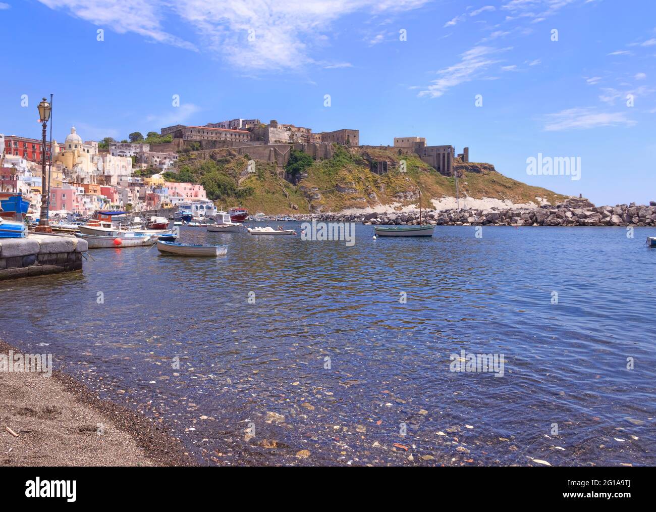 Panoramic view of Procida, Italian Capital of Culture 2022: colorful houses of Corricella old town in Gulf of Naples, Campania, Italy. Stock Photo