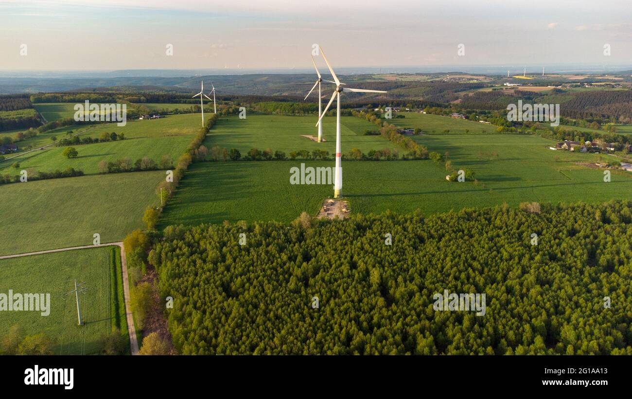 Aerial view of landscape in the Eifel region nearby Raffelsbrand, Germany with forest, meadows and wind wheels Stock Photo