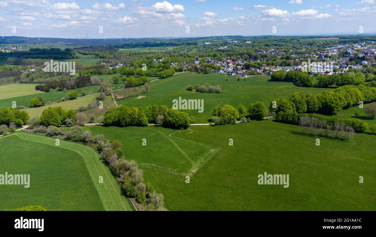Aerial view of landscape in the Eifel region with the city Simmerath, forest and farmland Stock Photo