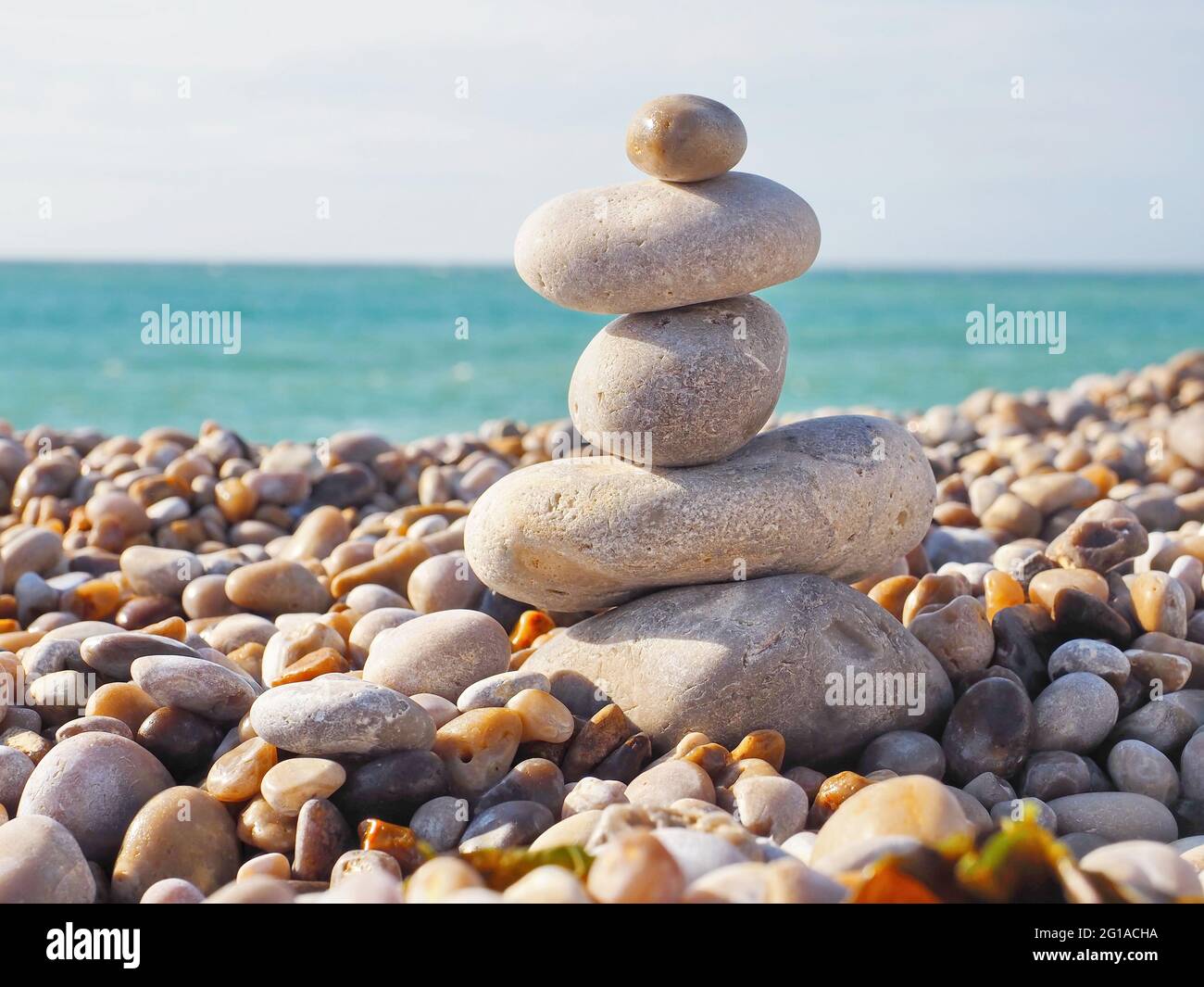 Tower made from big and small pebbles, Etretat, France Stock Photo