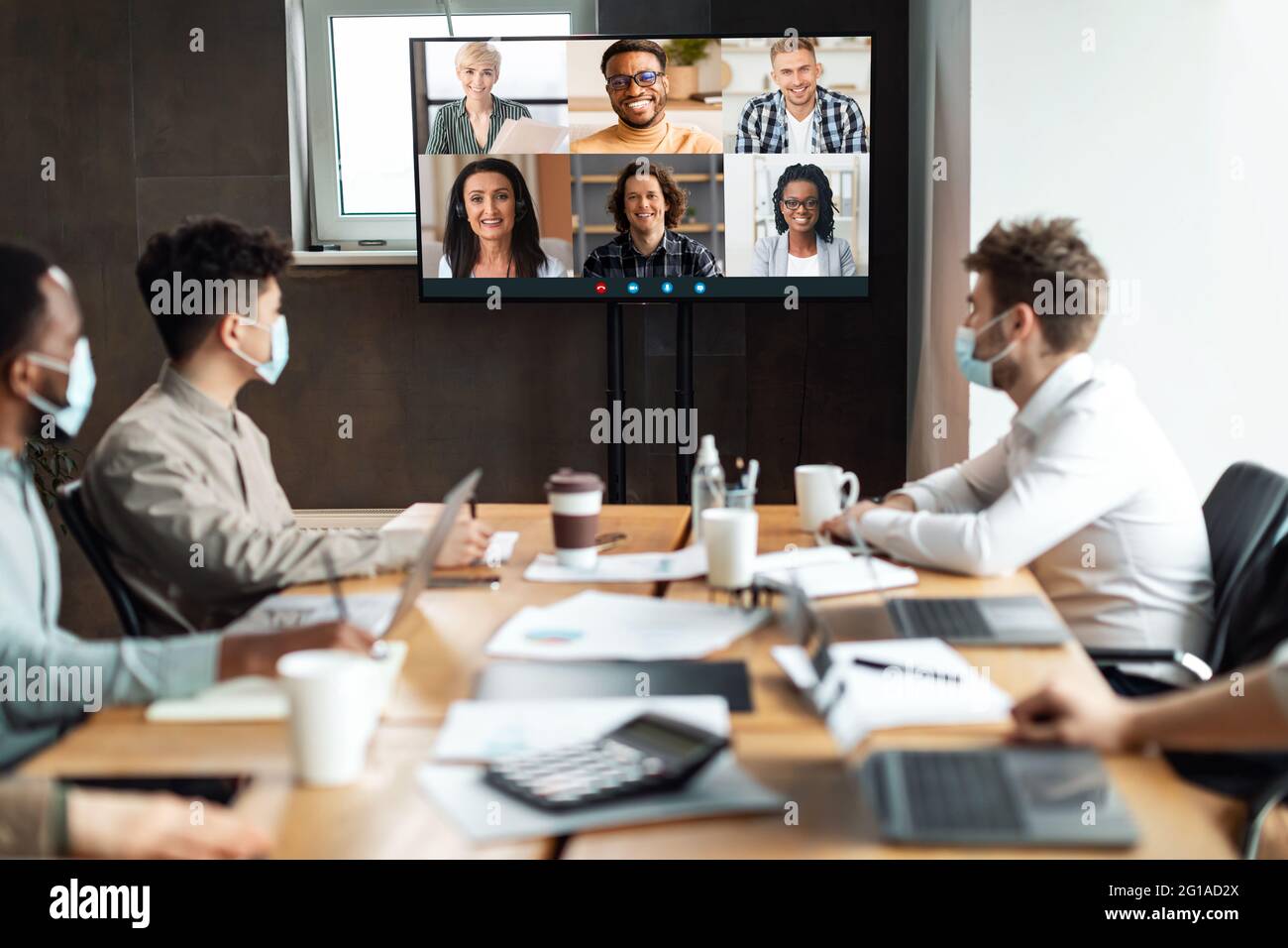 Diverse businesspeople making online videocall to employees Stock Photo