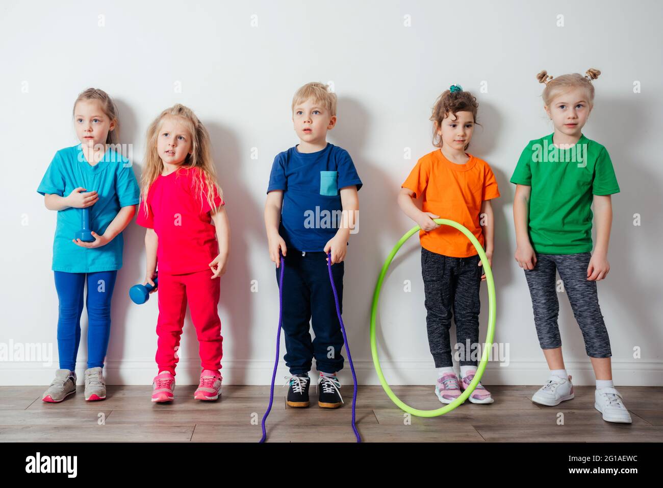 Young children adore doing physical activities at preschool Stock Photo