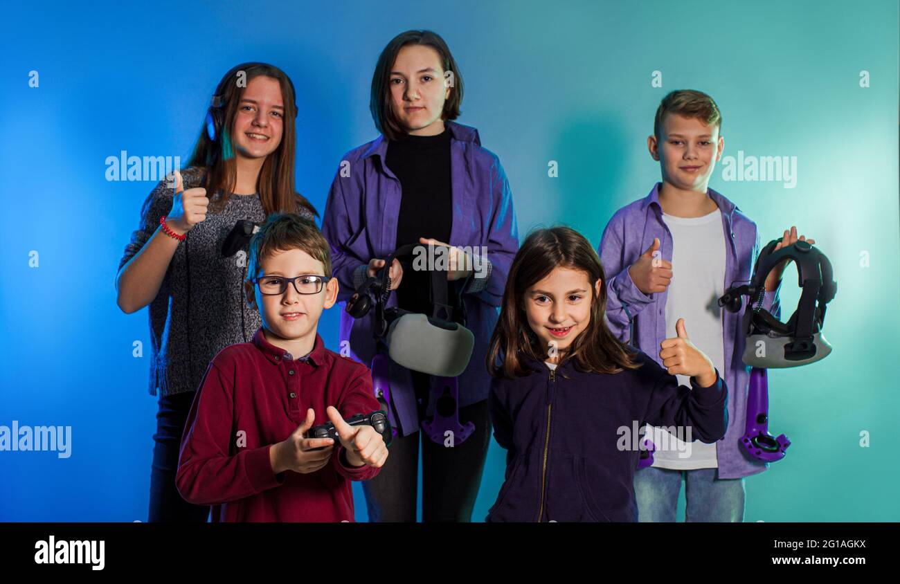 Group of kids using a gaming gadgets for virtual reality Stock Photo