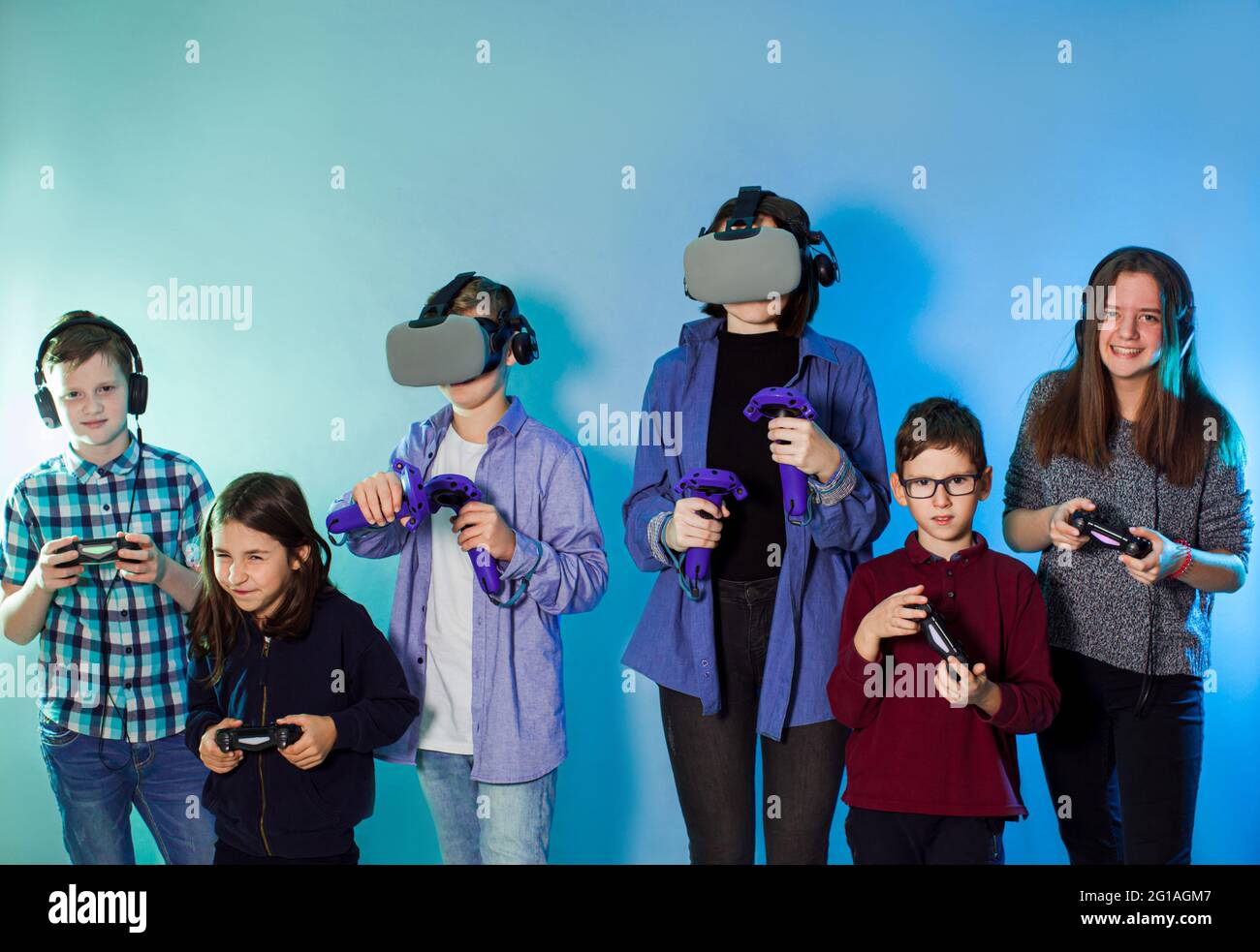 Group of kids using a gaming gadgets for virtual reality Stock Photo