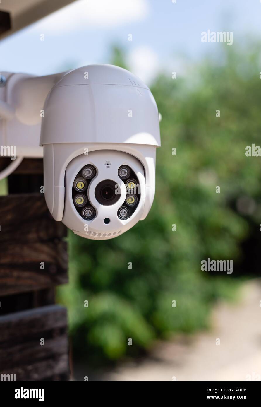 IP CCTV wifi surveillance camera on backyard background Stock Photo