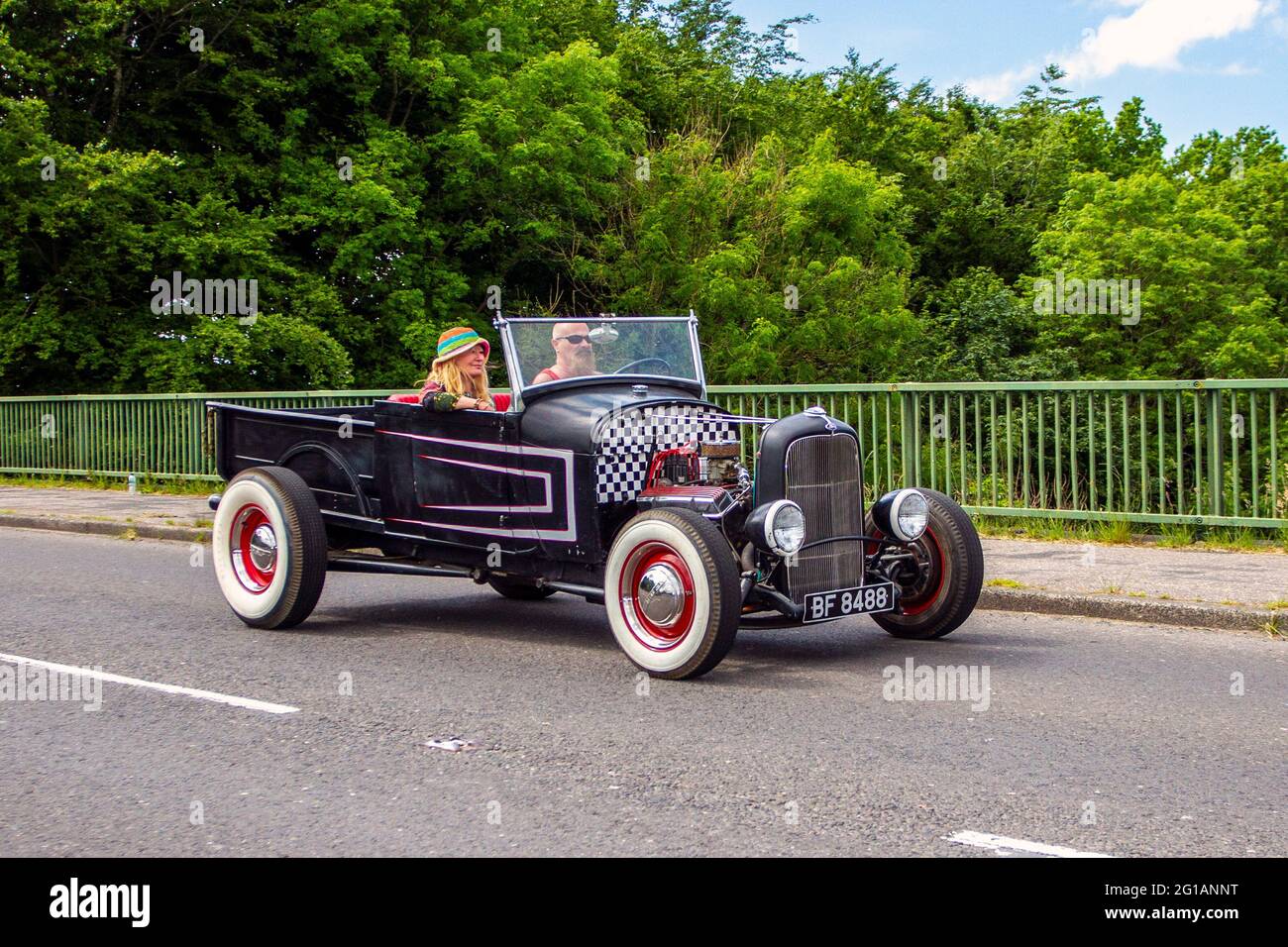 1930 30s thirties black Ford 3300 cc, Vintage Ford Model A Tudor sedan automobile driving in Chorley UK Stock Photo