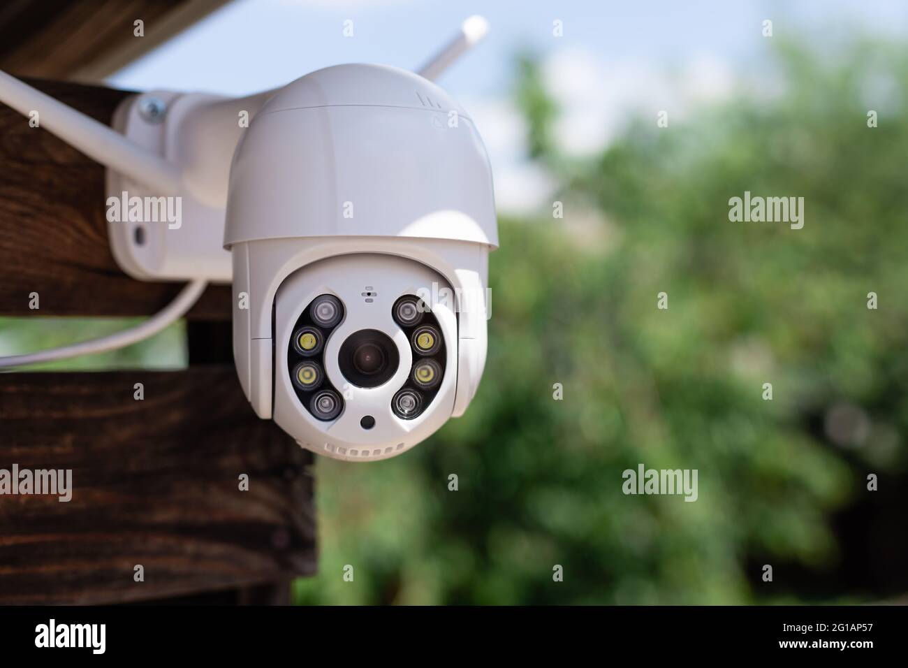modern CCTV wifi surveillance camera in backyard Stock Photo