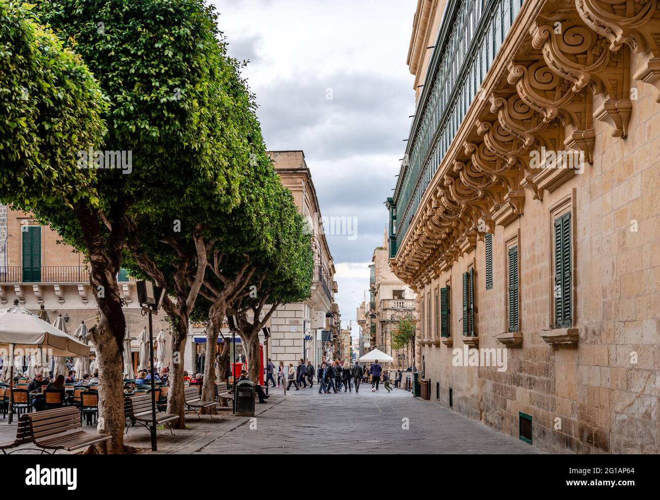 Valletta, Malta - February 20 2015: View of Old Theatre Street and the Republic Square, on a winter afternoon. Stock Photo