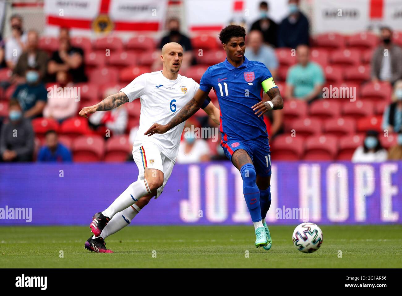 Romania's Vlad Chiriches (left) and England's Marcus Rashford battle for the ball during the international friendly match at Riverside Stadium, Middlesbrough. Picture date: Sunday June 6, 2021. Stock Photo